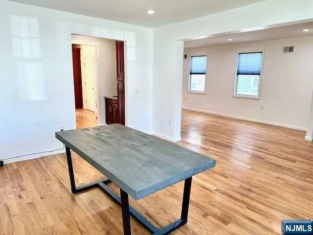 a room with wooden floor and a window