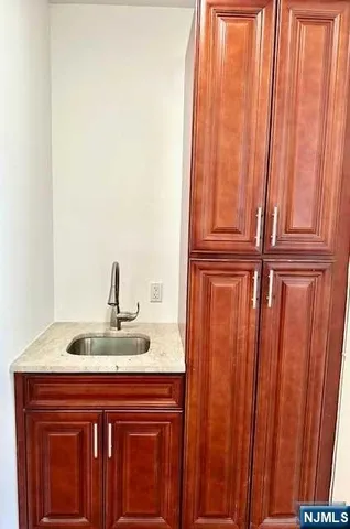 a bathroom with a sink and vanity