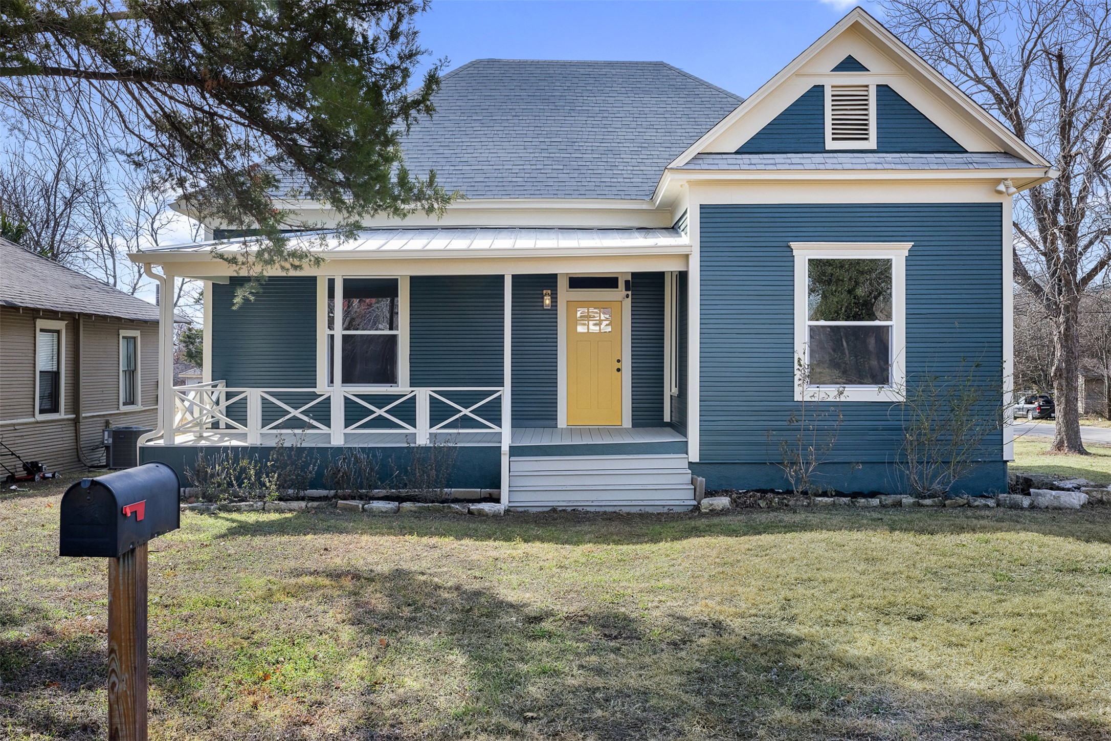 1019 West 4th Street Taylor, TX 76574 - Photo 2 of 20 a front view of a house with garden