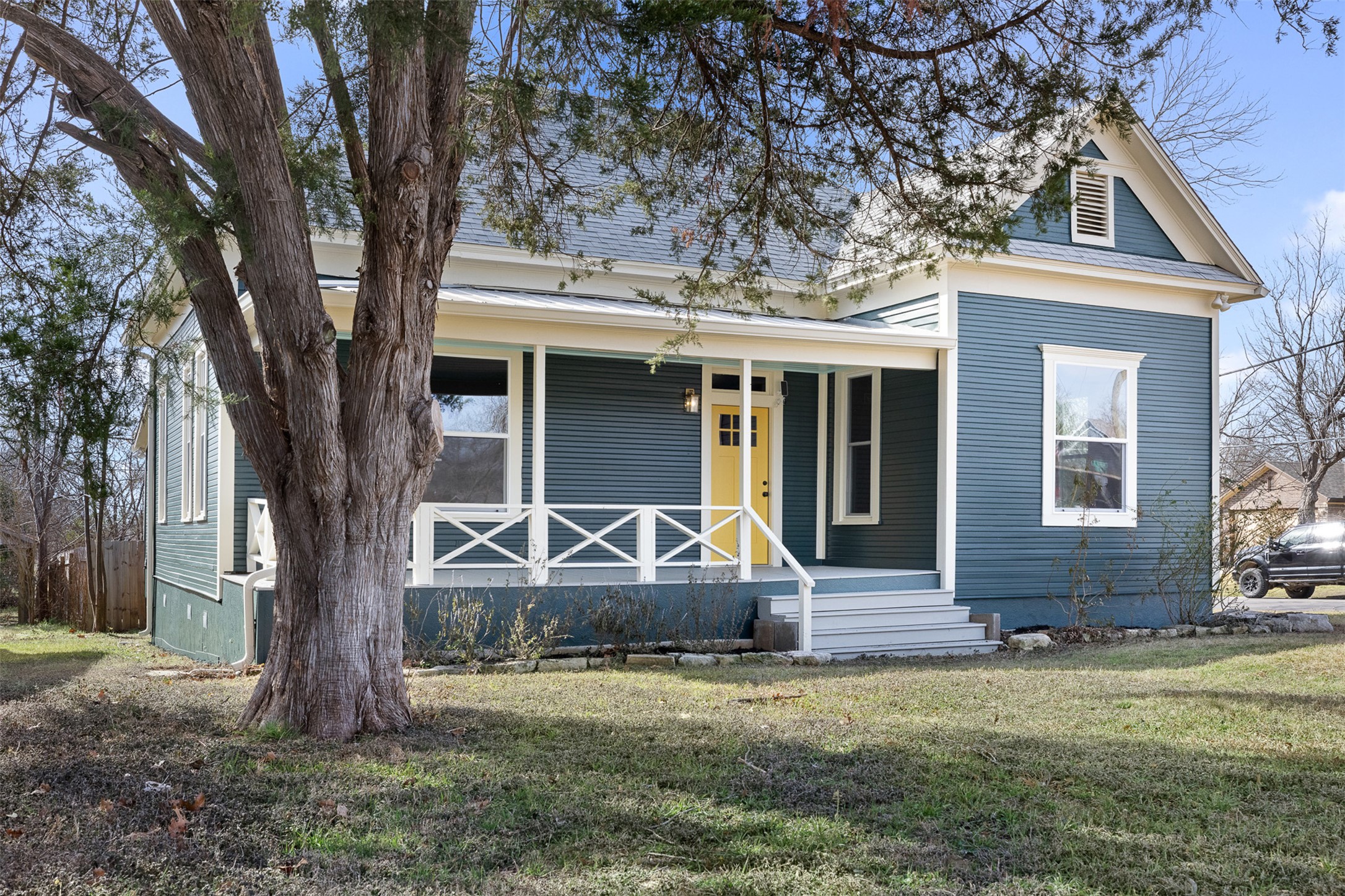 1019 West 4th Street Taylor, TX 76574 - Photo 3 of 20 a front view of a house with garden