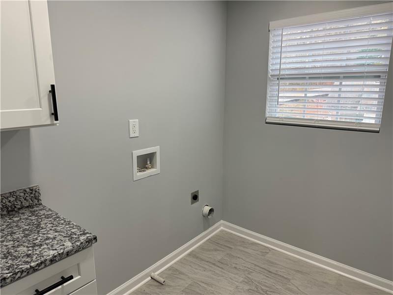 1202 Pisgah Road Southwest Austell, GA 30168 - Photo 15 of 30 a view of storage and utility room with wooden floor