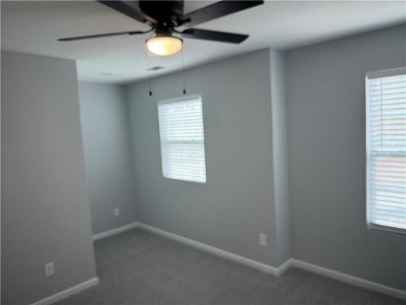 1202 Pisgah Road Southwest Austell, GA 30168 - Photo 17 of 30 an empty room with windows and fan