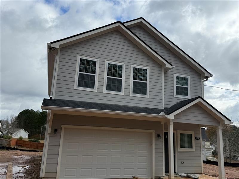 1202 Pisgah Road Southwest Austell, GA 30168 - Photo 2 of 30 a front view of a house with a yard