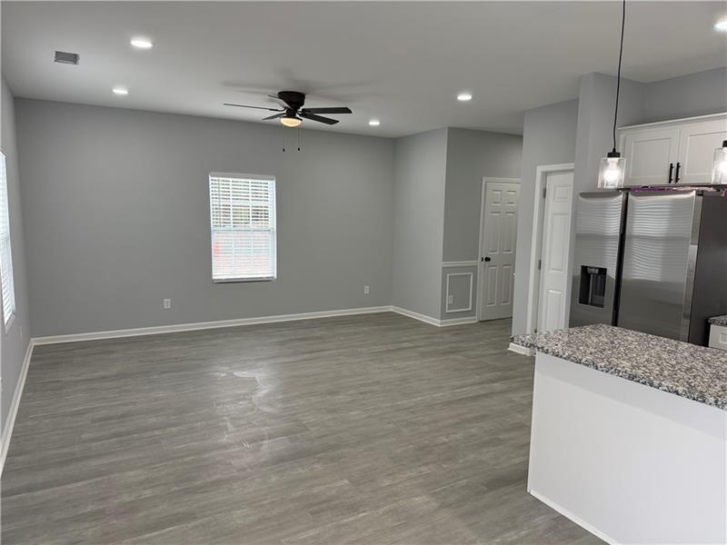 1202 Pisgah Road Southwest Austell, GA 30168 - Photo 23 of 30 a view of a kitchen center island wooden floor and a window