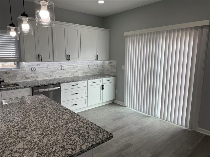 1202 Pisgah Road Southwest Austell, GA 30168 - Photo 26 of 30 a bathroom with a granite countertop sink and a mirror