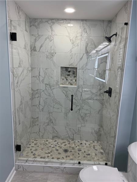 1202 Pisgah Road Southwest Austell, GA 30168 - Photo 6 of 30 a bathroom with a shower and toilet