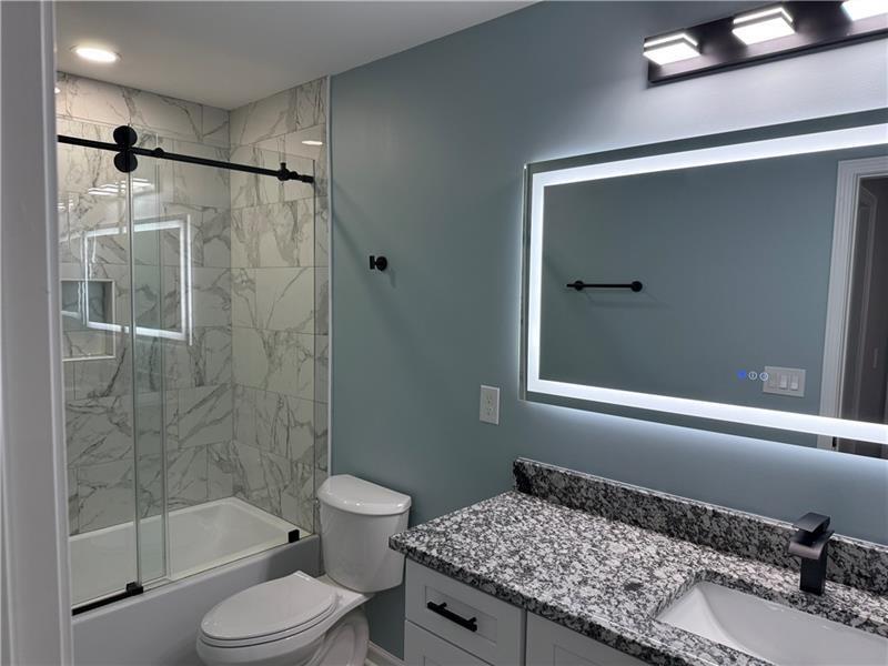 1202 Pisgah Road Southwest Austell, GA 30168 - Photo 8 of 30 a bathroom with a sink and a toilet