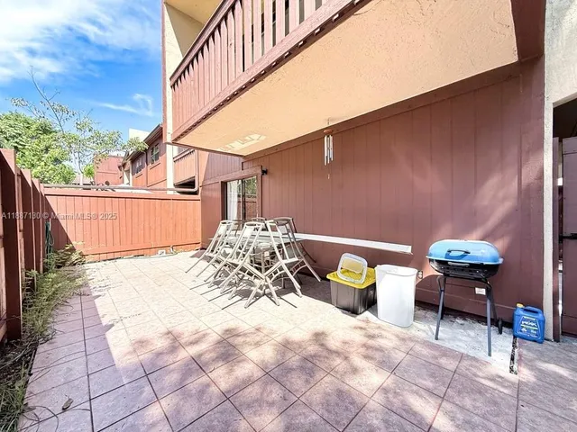 a view of balcony with wooden floor