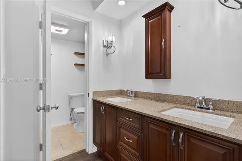 a bathroom with a sink double vanity and a mirror