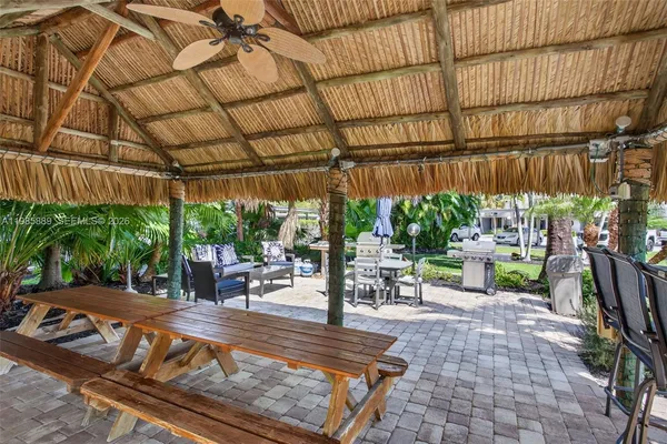 a view of a backyard with sitting area