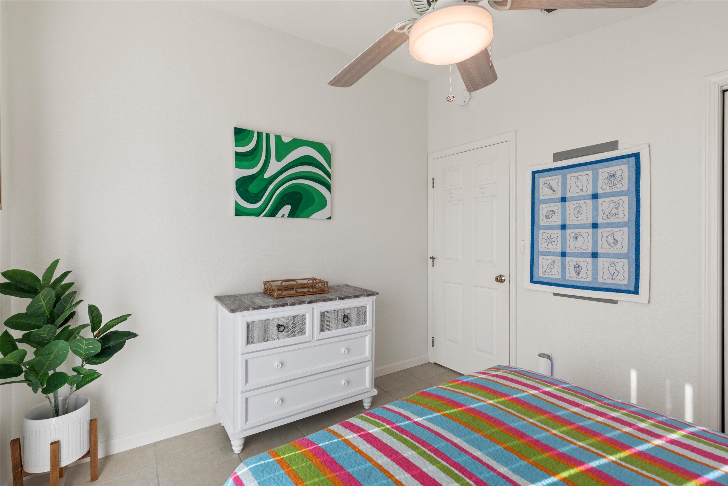 157 Mars Lane Key West, FL 33040 - Photo 26 of 41 a bedroom with a bed and a potted plant