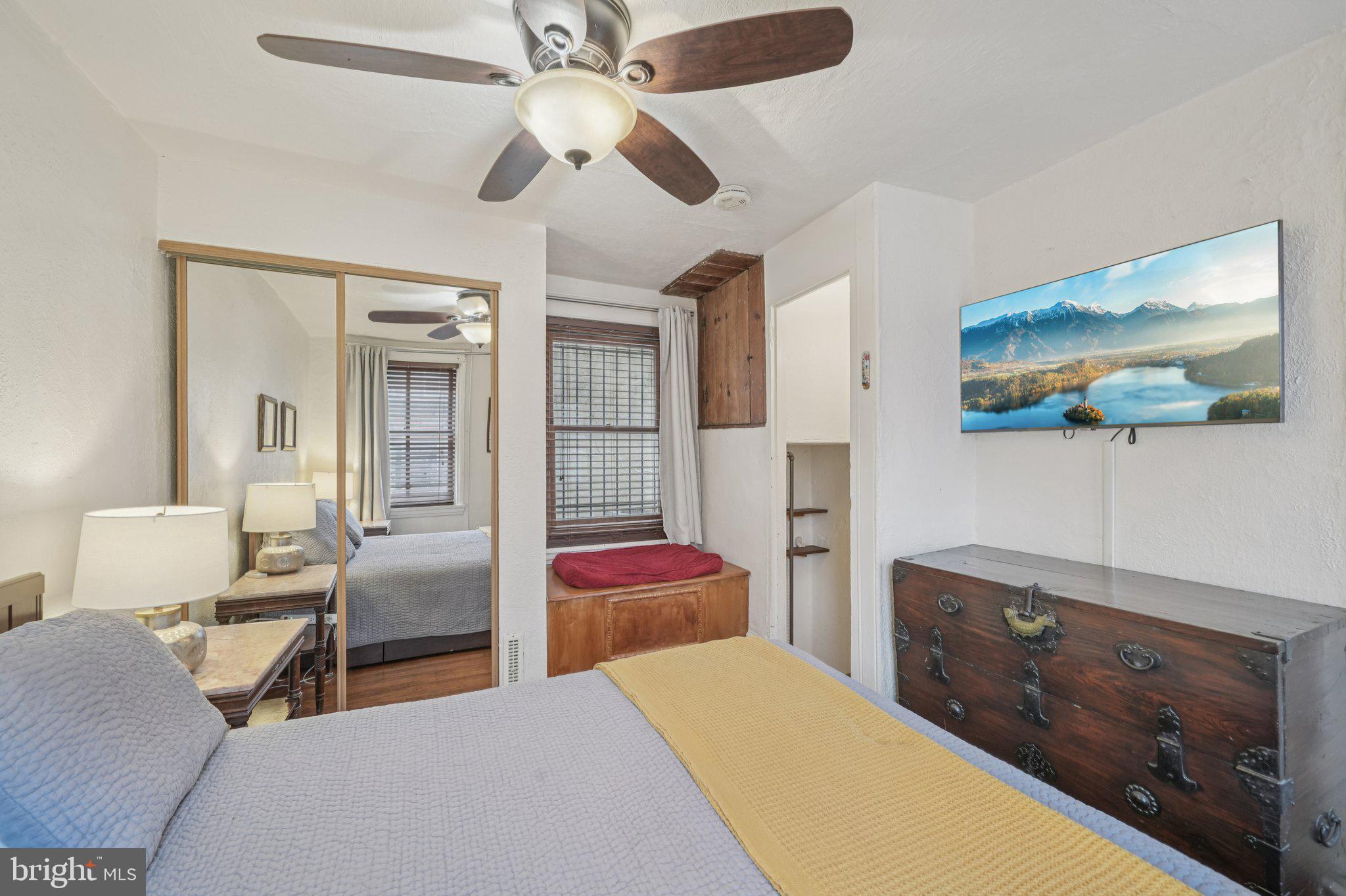 405 South 17th Street Philadelphia, PA 19146 - Photo 19 of 24 a bedroom with a bed and a chandelier