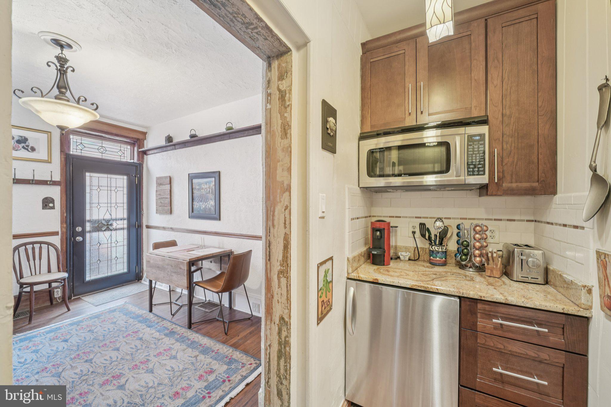 405 South 17th Street Philadelphia, PA 19146 - Photo 4 of 24 a kitchen with stainless steel appliances granite countertop a stove and cabinets