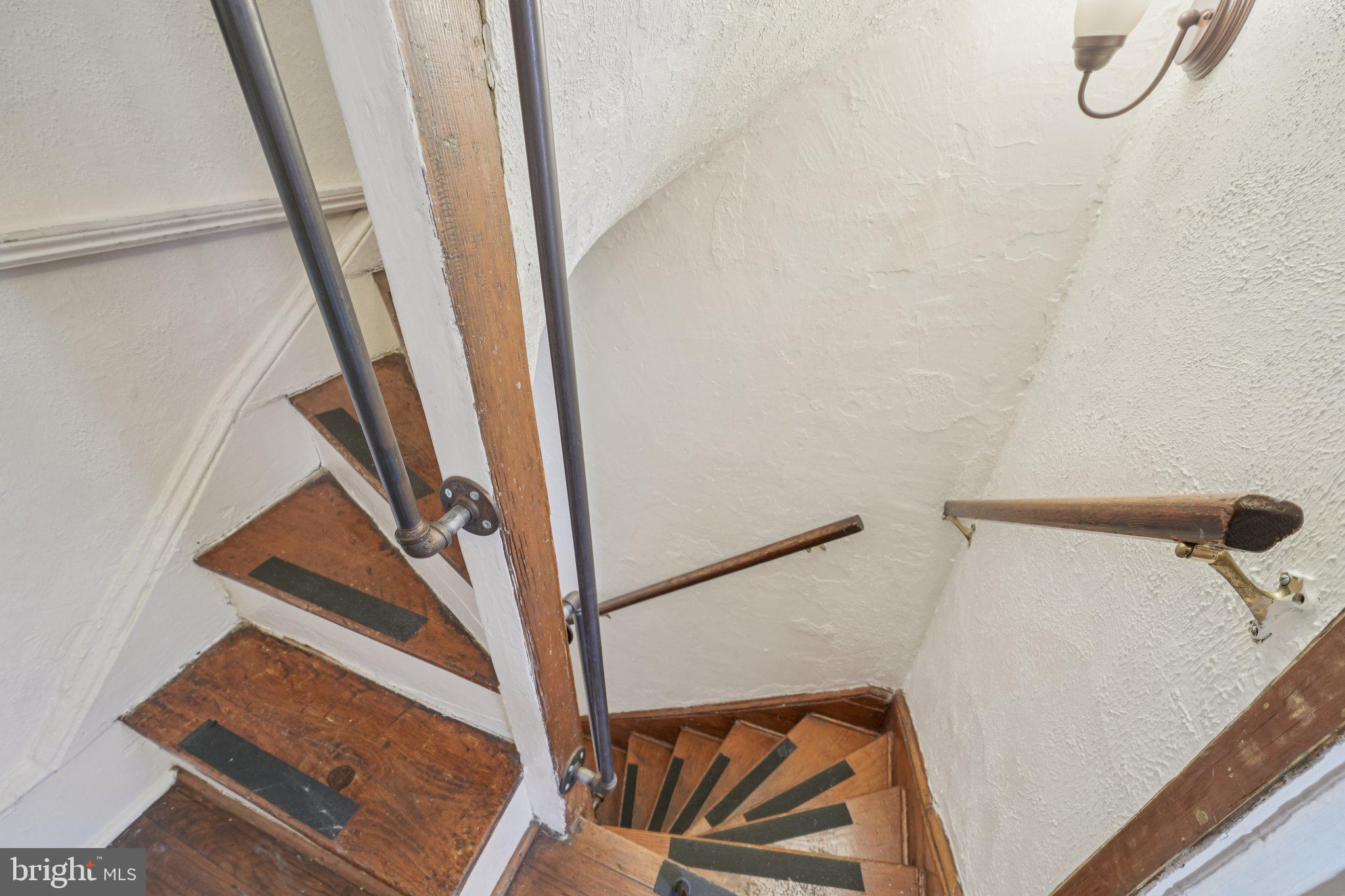 405 South 17th Street Philadelphia, PA 19146 - Photo 8 of 24 a view of staircase with white walls and a window