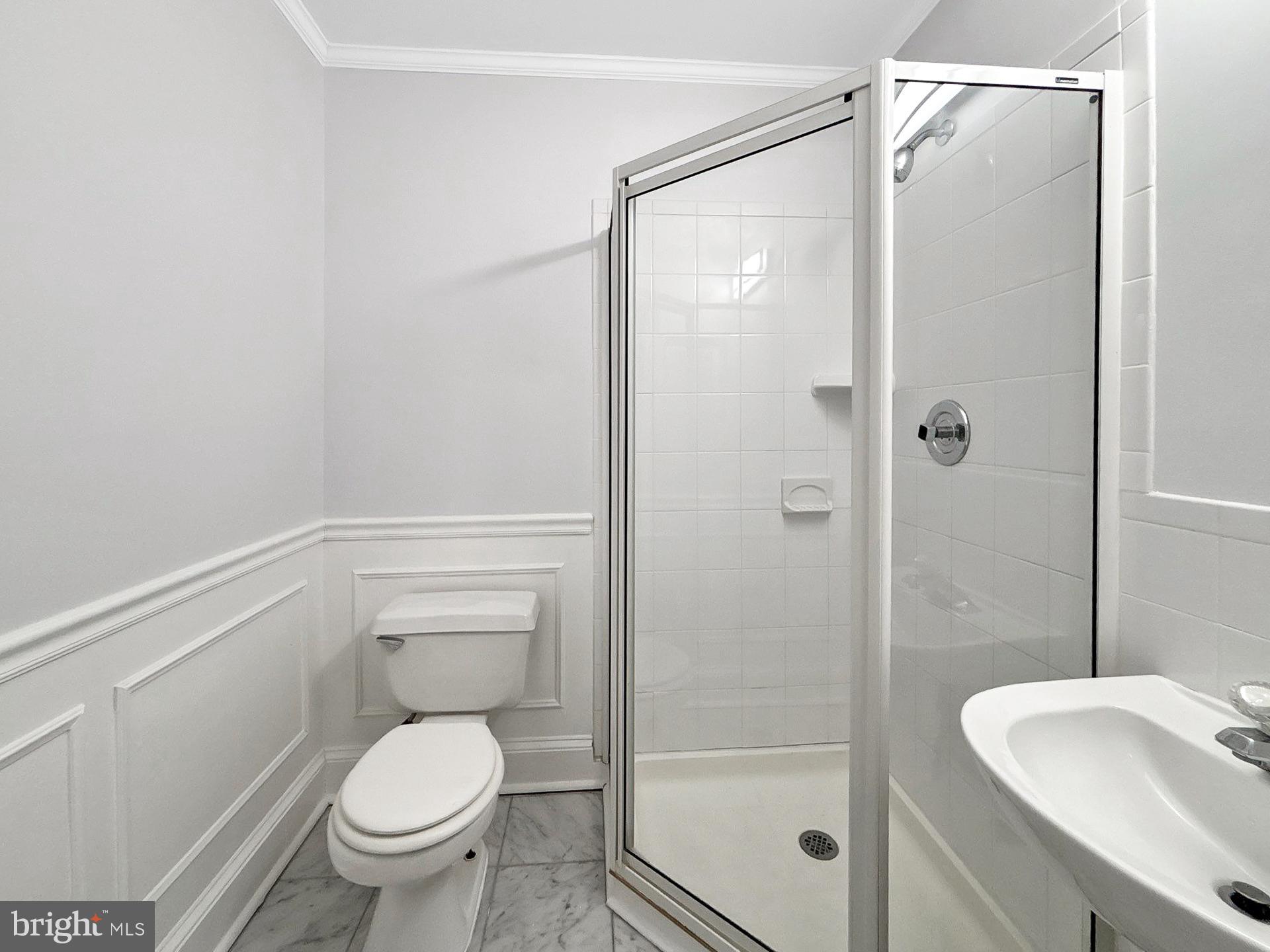 3558 Corn Stream Road Randallstown, MD 21133 - Photo 12 of 28 a bathroom with a granite countertop sink toilet and shower