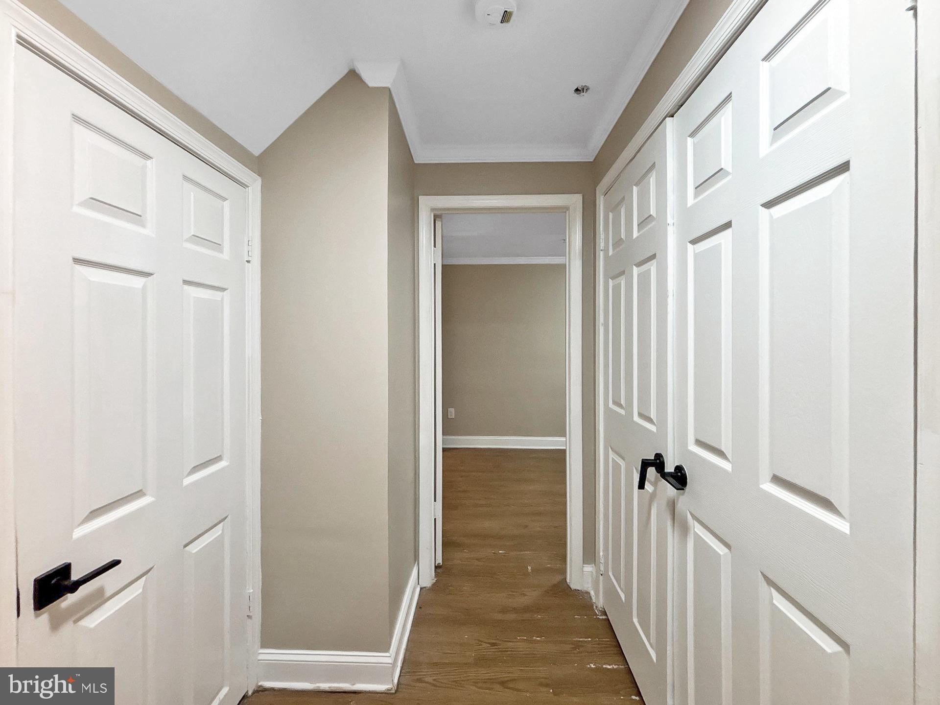 3558 Corn Stream Road Randallstown, MD 21133 - Photo 18 of 28 a view of a hallway with a white door