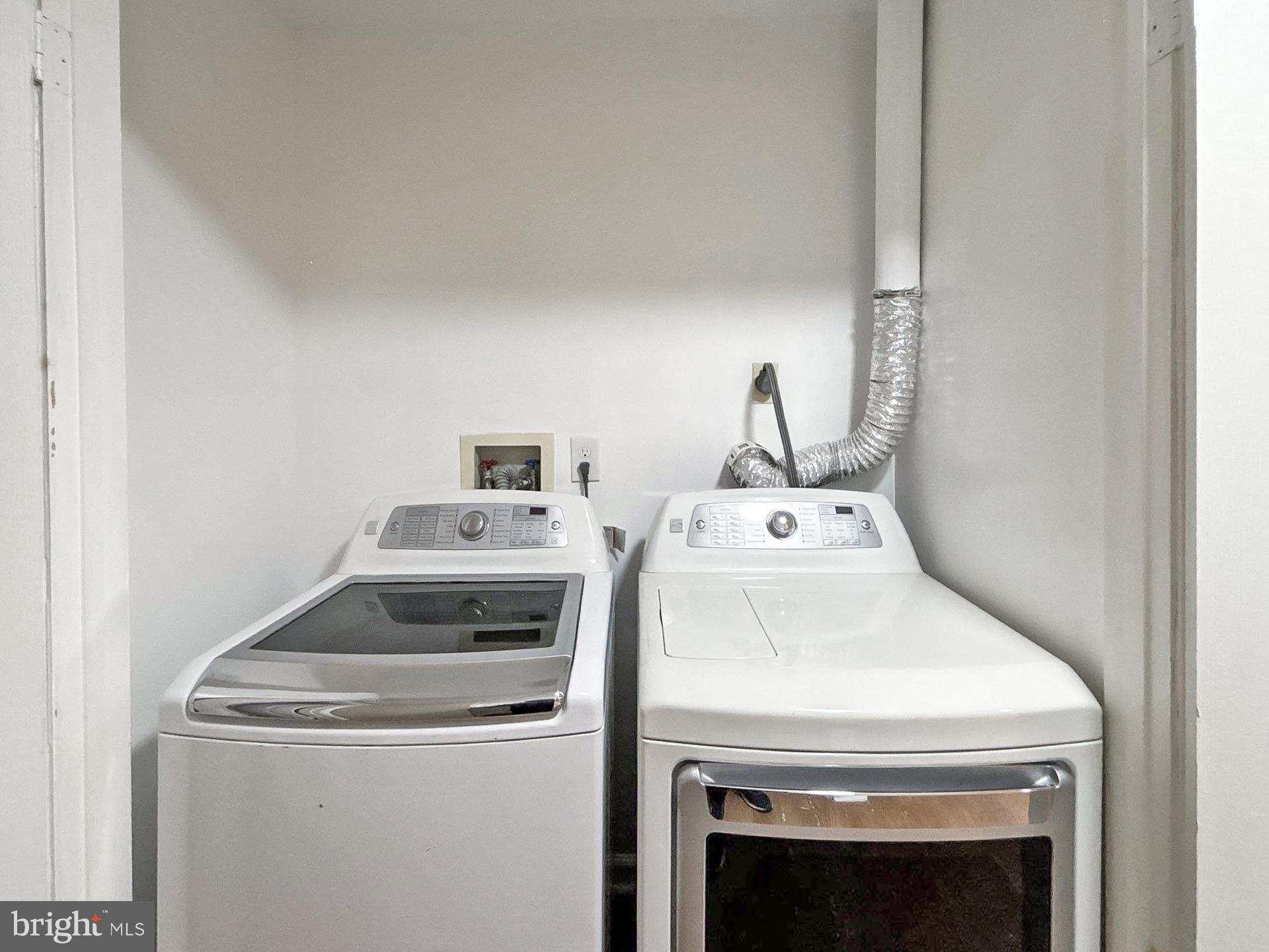 3558 Corn Stream Road Randallstown, MD 21133 - Photo 19 of 28 a utility room with dryer and washer