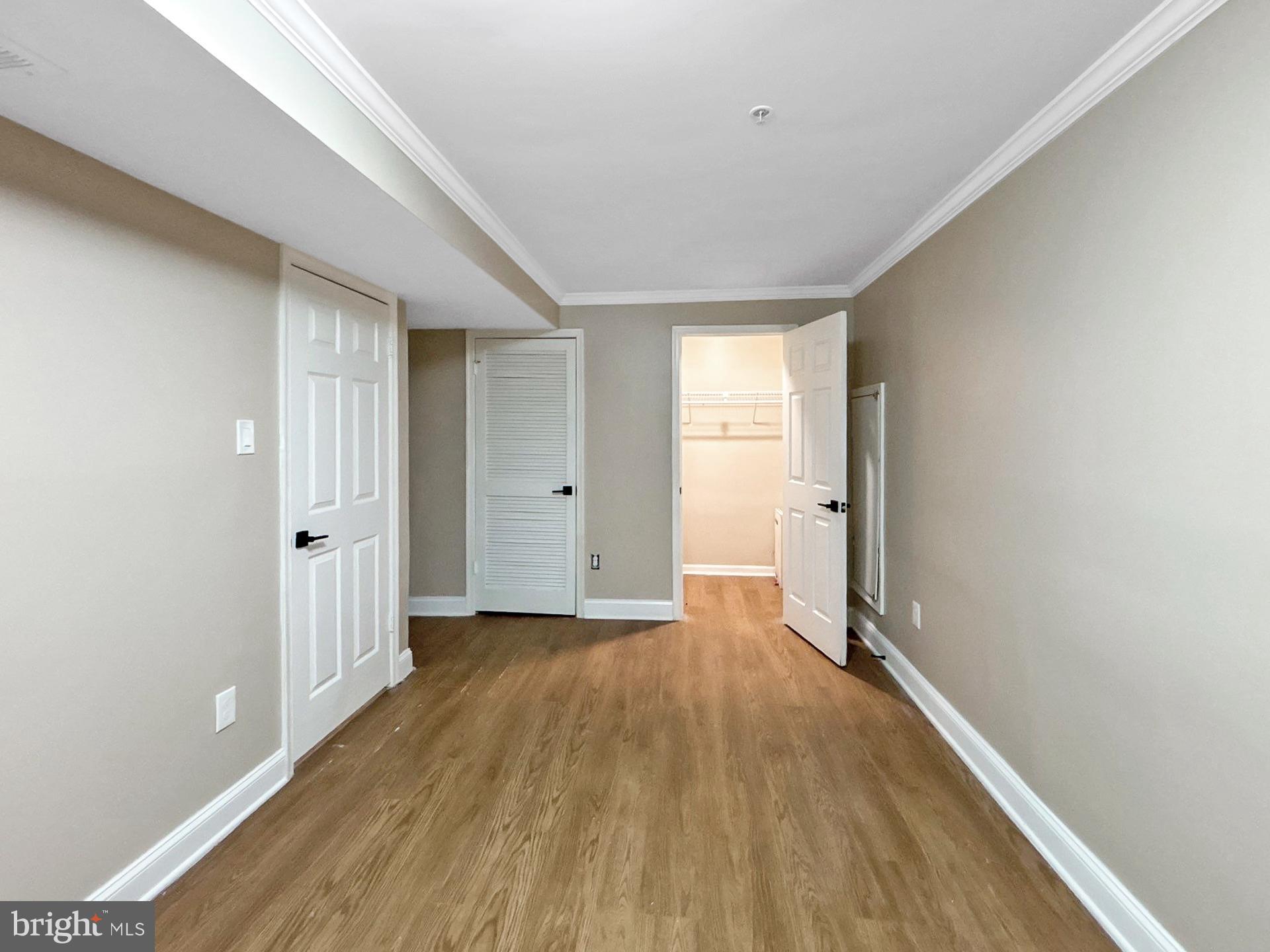 3558 Corn Stream Road Randallstown, MD 21133 - Photo 20 of 28 a view of a livingroom with wooden floor and a window