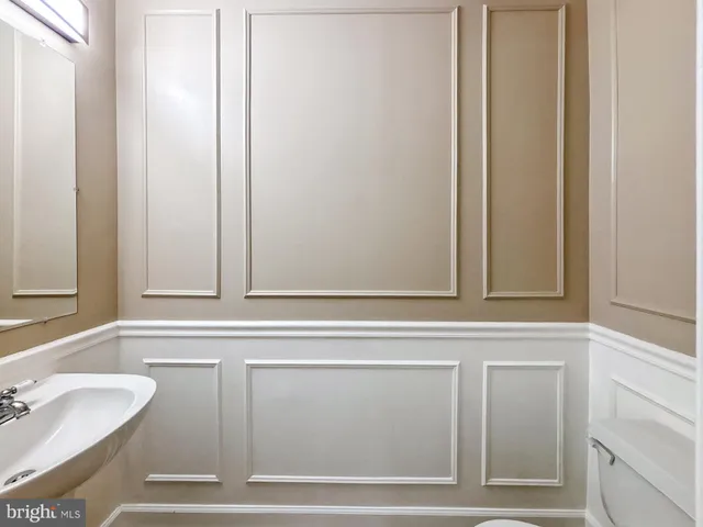 a bathroom with a sink and mirror