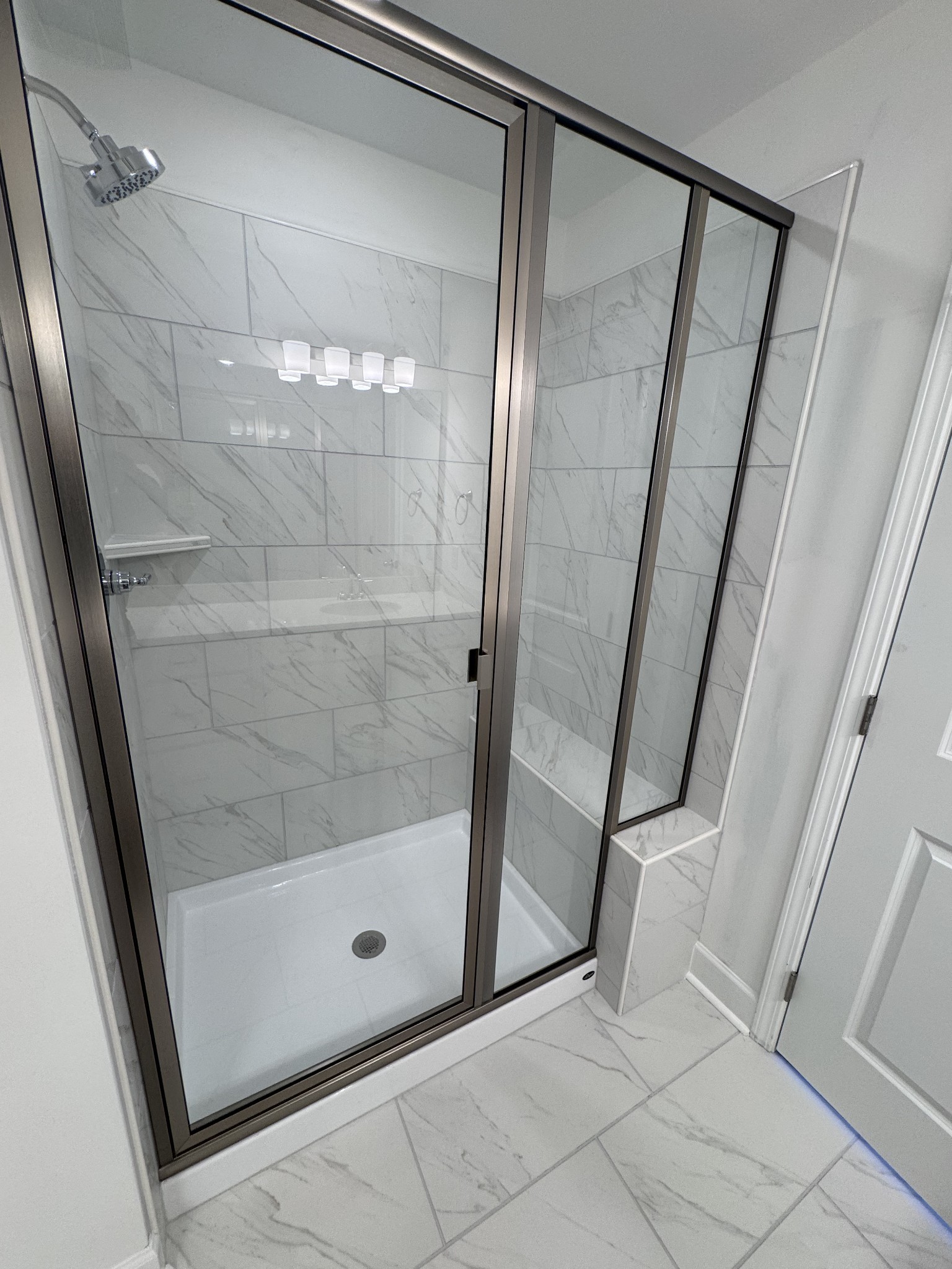 1095 June Wilde Ridge Spring Hill, TN 37174 - Photo 26 of 33 a bathroom with a glass shower door