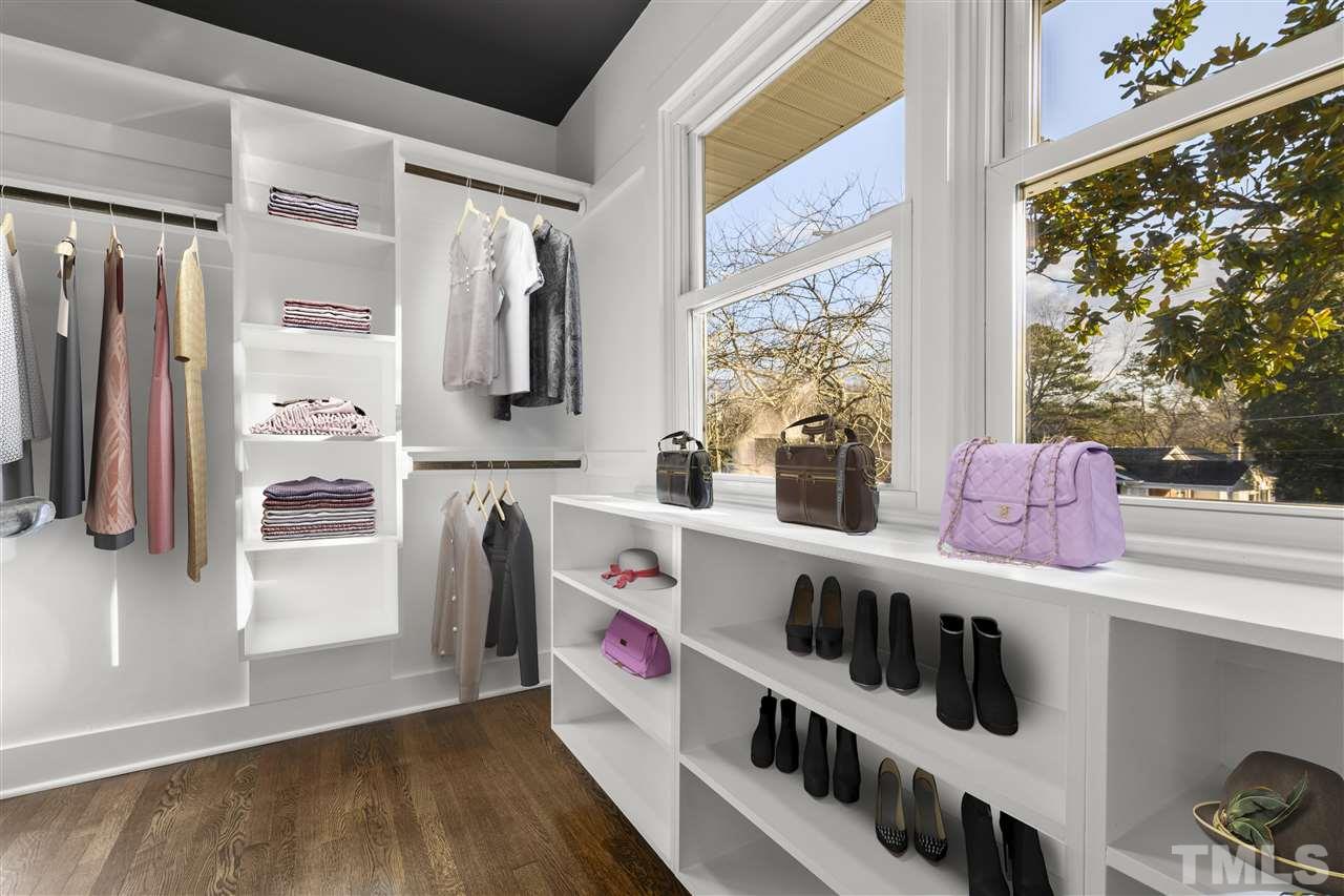 321 Compton Road Raleigh, NC 27609 - Photo 14 of 26 a view of an entryway with wooden floor and windows