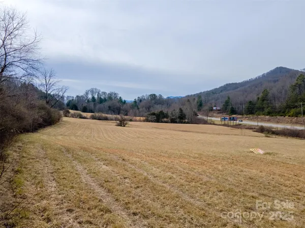 a view of a town with mountains in the background