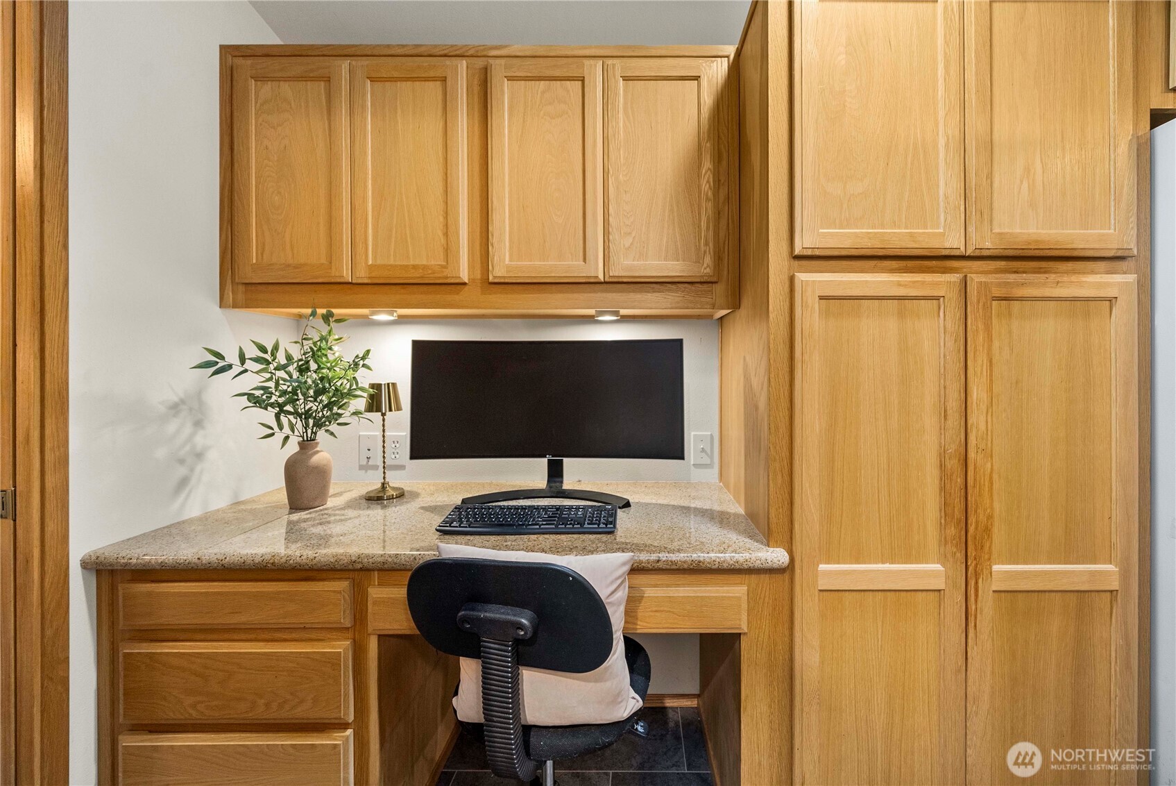1546 Reservation Road Southeast, Unit 62 Olympia, WA 98513 - Photo 11 of 39 a table with a chair and a wooden floor