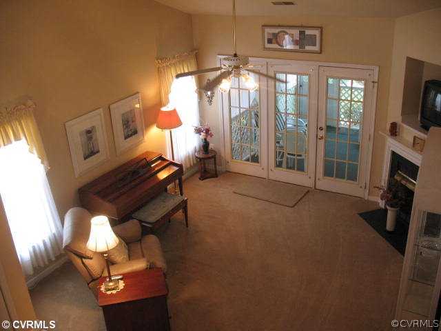 14337 Lookout Point Road Midlothian, VA 23112 - Photo 2 of 12 Den/Family/Great Room - Great room with cathedral ceilings, gas fireplace with TV niche above, door to the screened-in porch.
