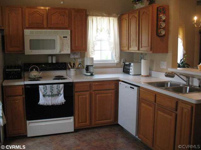 14337 Lookout Point Road Midlothian, VA 23112 - Photo 3 of 12 Kitchen - Lovely kitchen with plenty of counter and cabinet space, pantry, breakfast bar, refrigerator conveys with the property, as well as the washer and dryer.