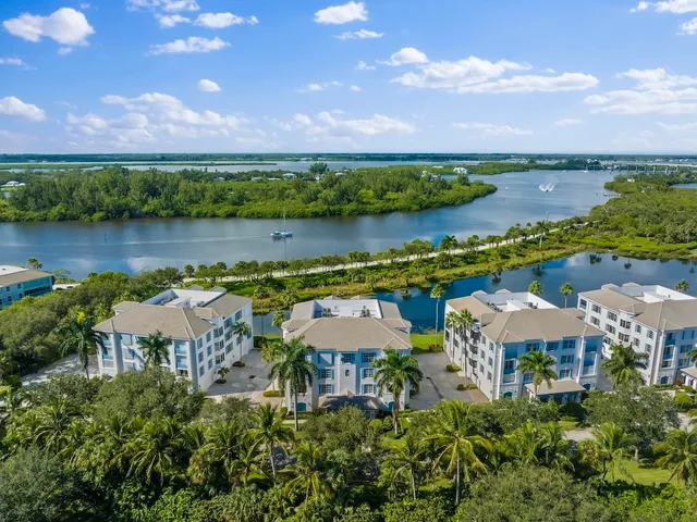 an aerial view of a house with a lake view and a lake view
