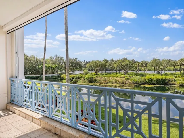 a view of a chairs and table in the balcony