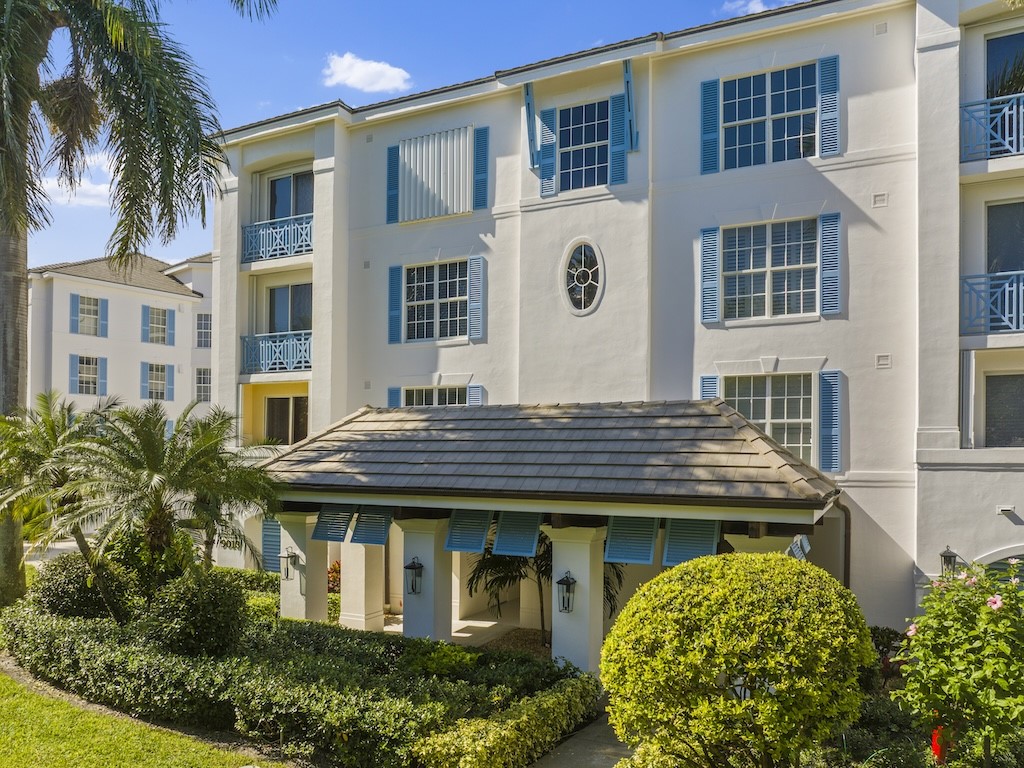9013 Somerset Bay Lane, Unit 201 Vero Beach, FL 32963 - Photo 23 of 27 a house view with a garden space