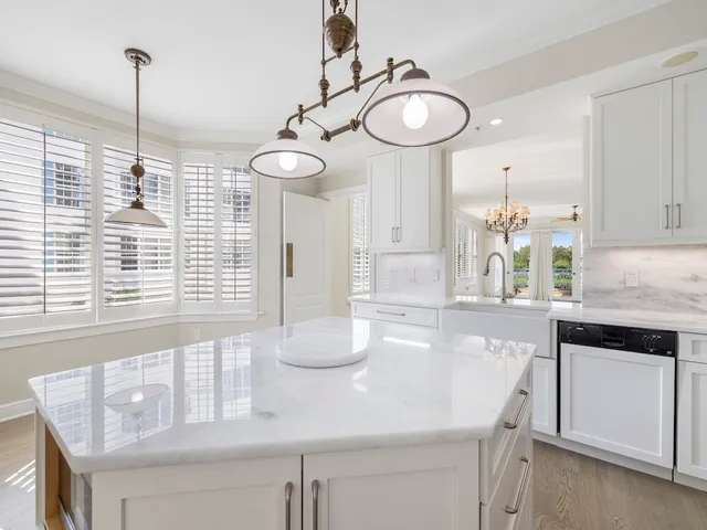 a kitchen with a table and chairs