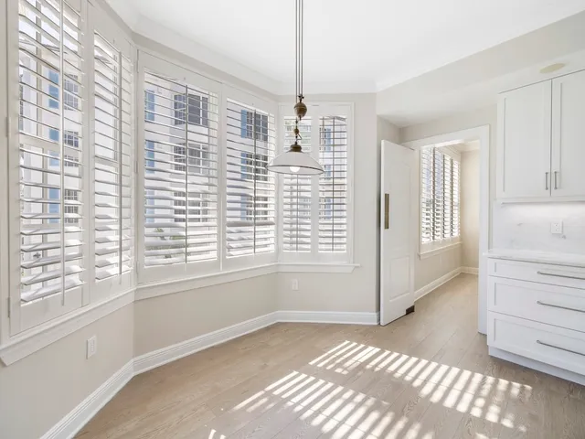a view of a bedroom with windows