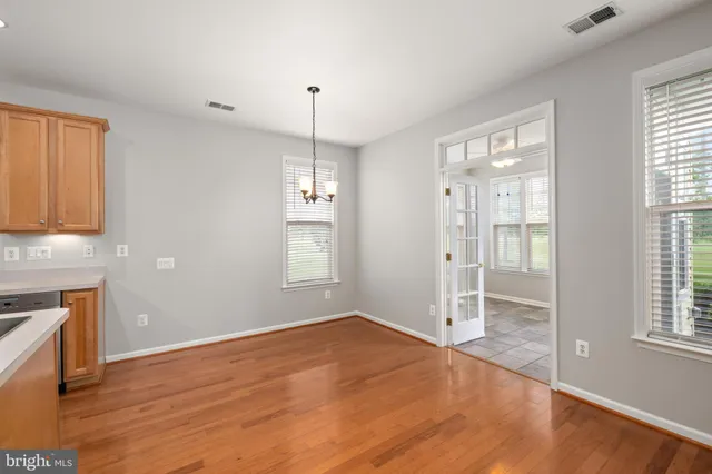 a bathroom with a granite countertop bathtub shower sink and mirror