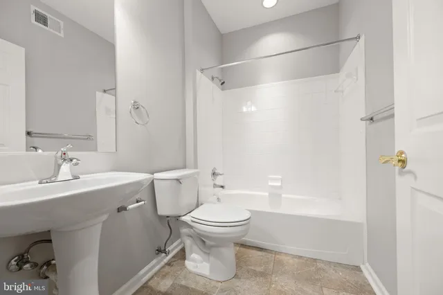 an aerial view of a house with garden space and ocean view