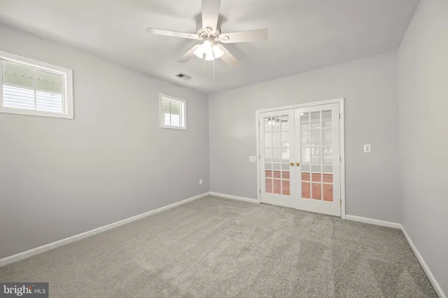 a aerial view of a house with a garden and outdoor seating