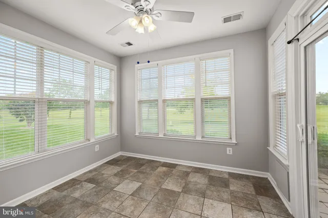 an aerial view of residential houses with outdoor space and lakeside