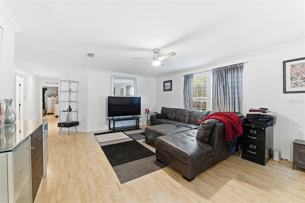 725 Cypress Road St. Augustine, FL 32086 - Photo 20 of 29 a living room with furniture and a flat screen tv