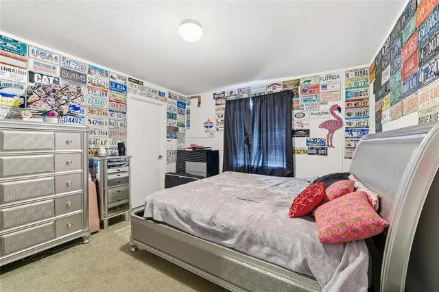 a bedroom with a bed and a cabinets