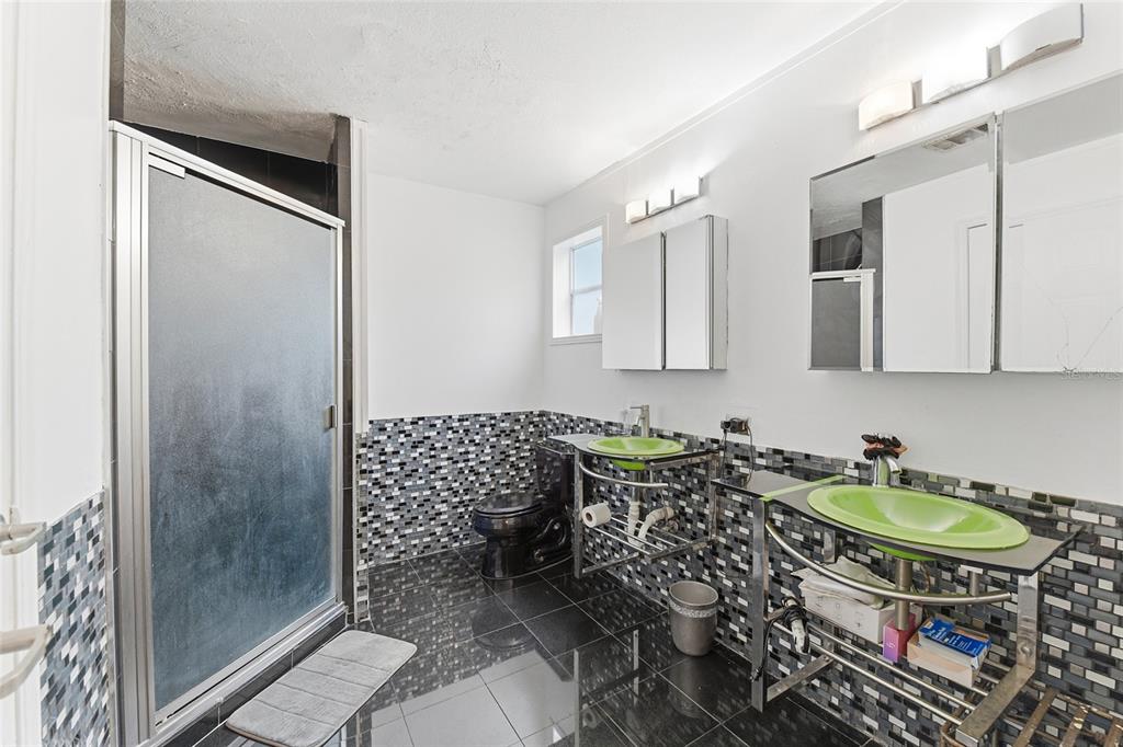 725 Cypress Road St. Augustine, FL 32086 - Photo 26 of 29 a bathroom with a sink toilet and shower