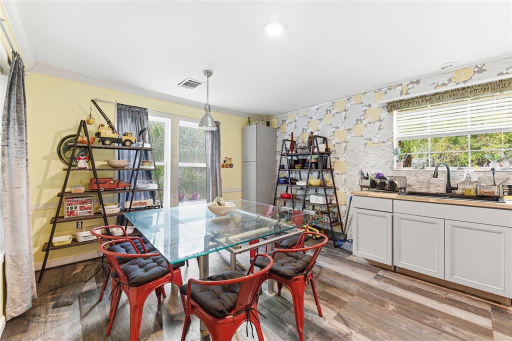 725 Cypress Road St. Augustine, FL 32086 - Photo 27 of 29 a view of a dining room with furniture window and outside view