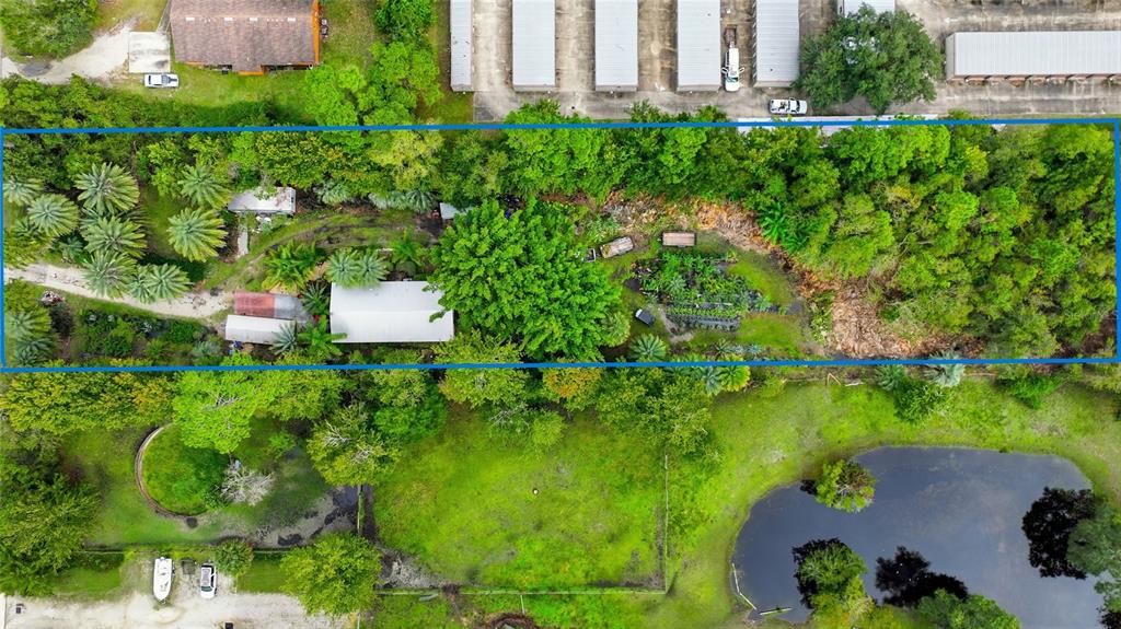 725 Cypress Road St. Augustine, FL 32086 - Photo 9 of 29 an aerial view of a house with a yard and lake view