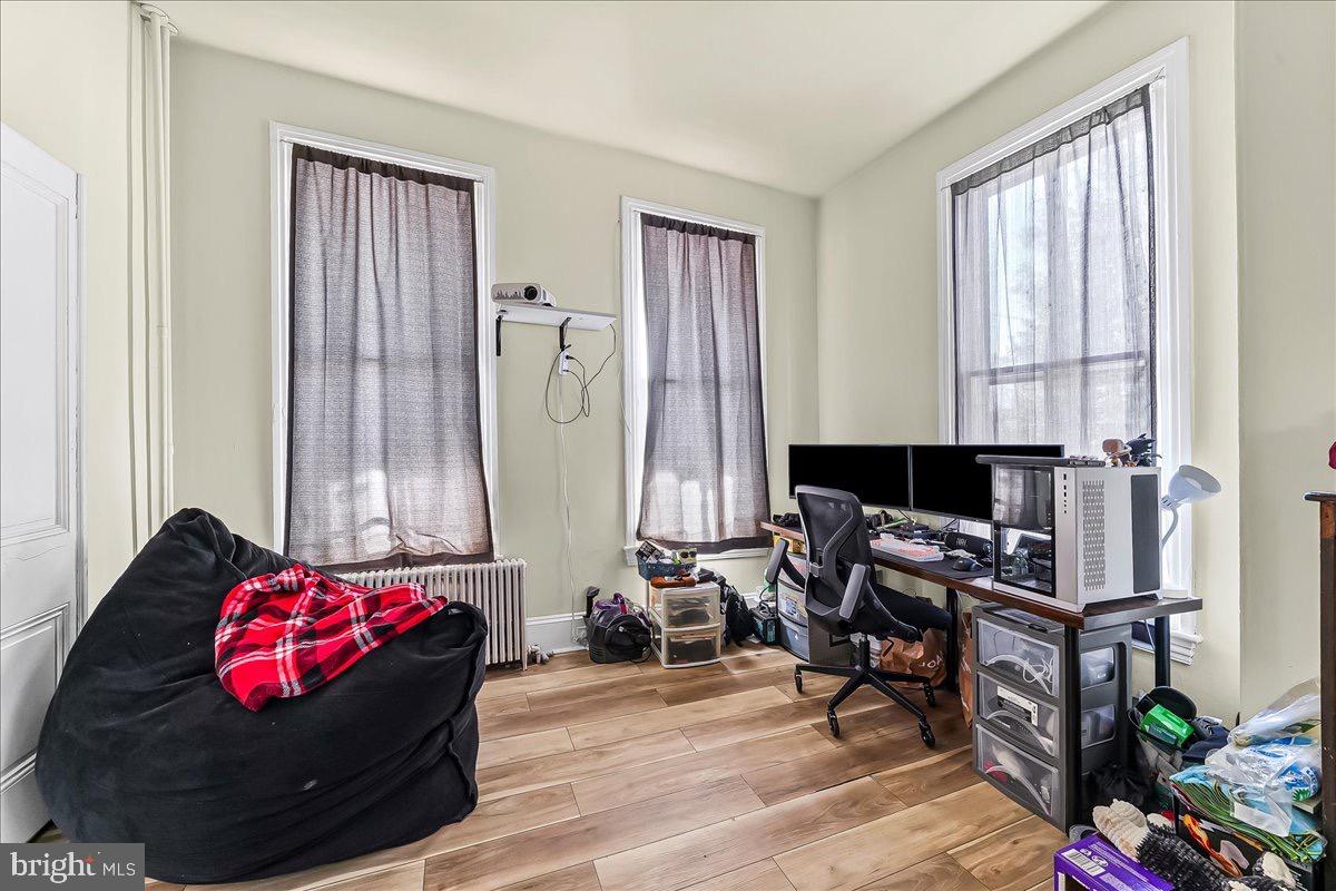 217 West Main Street Elkton, MD 21921 - Photo 18 of 37 a living room with furniture and a wooden floor