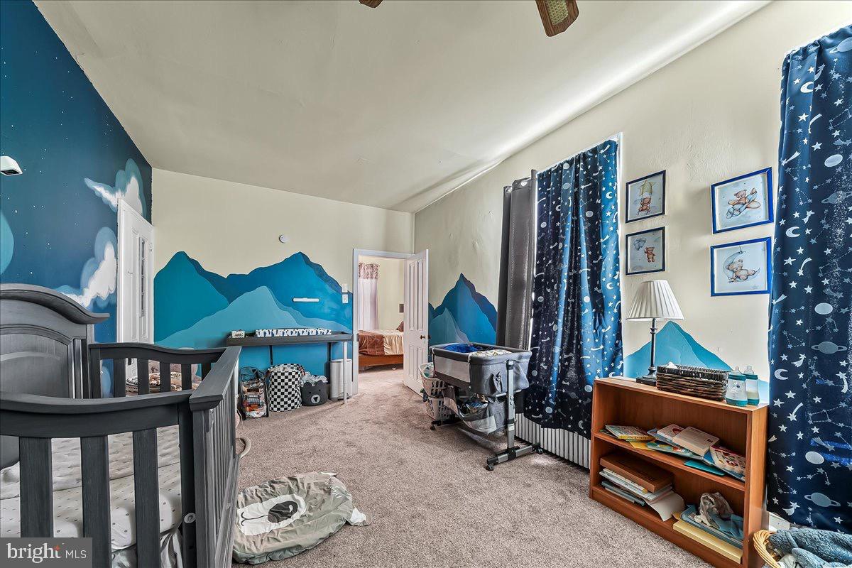 217 West Main Street Elkton, MD 21921 - Photo 23 of 37 a bedroom with furniture and a lamp