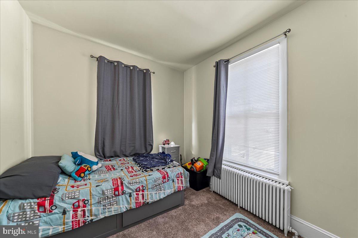217 West Main Street Elkton, MD 21921 - Photo 25 of 37 a bedroom with a bed and a window