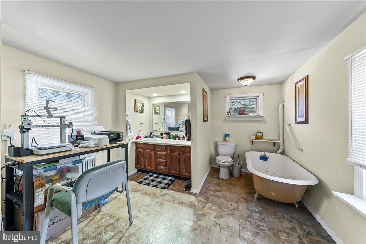217 West Main Street Elkton, MD 21921 - Photo 27 of 37 a spacious bathroom with a tub double vanity and window