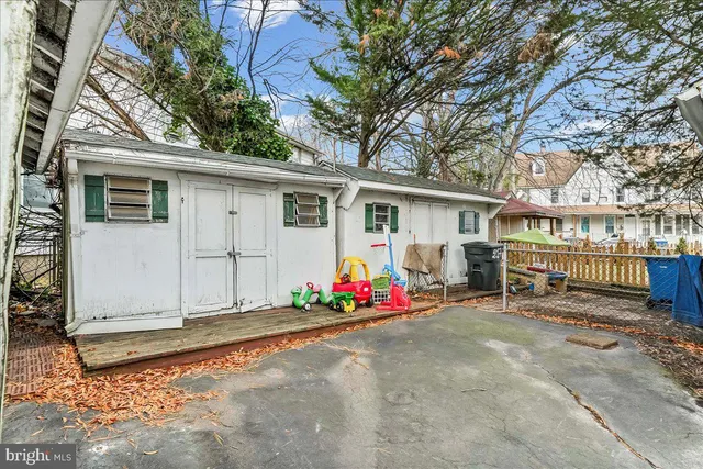 a view of a house with wooden fence