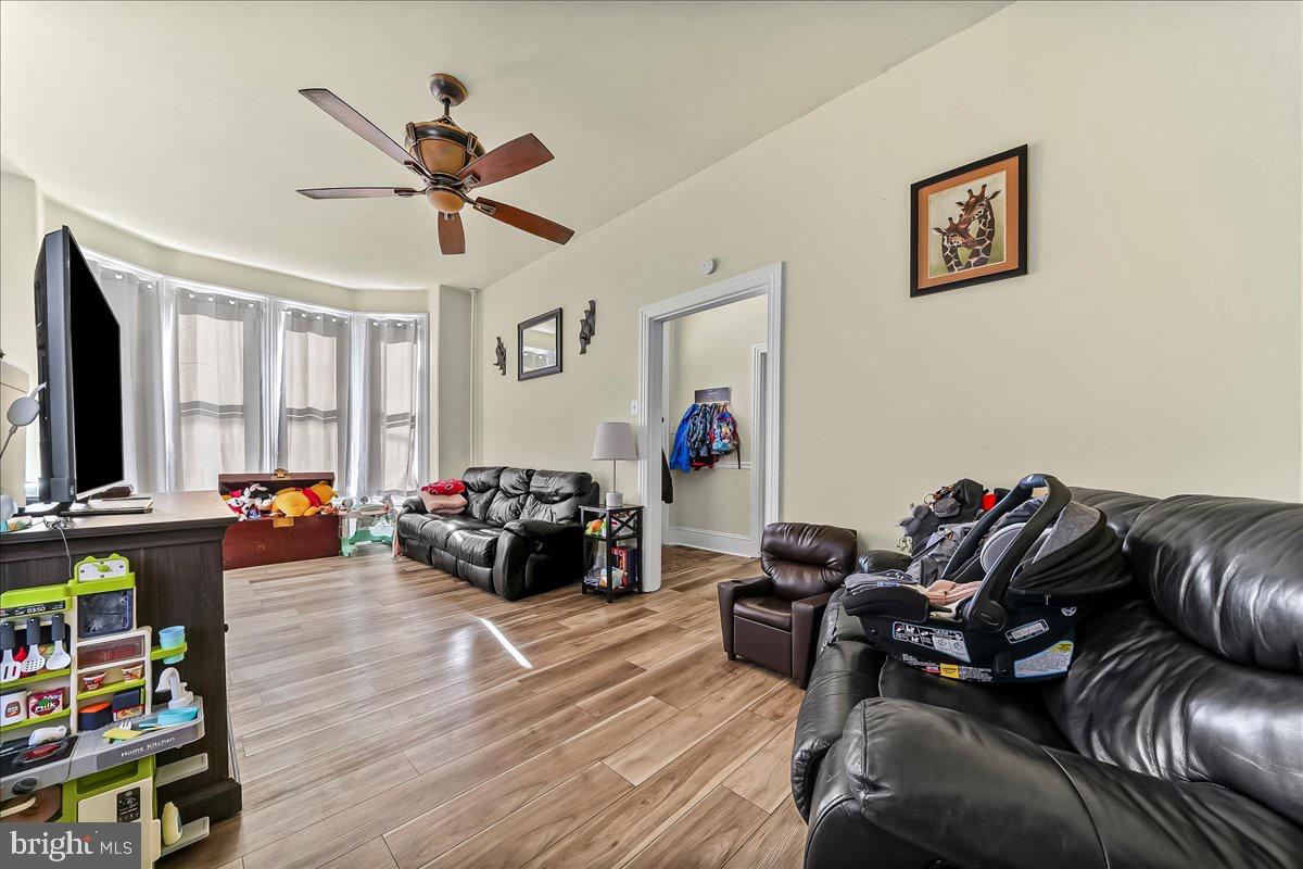 217 West Main Street Elkton, MD 21921 - Photo 4 of 37 a living room with furniture and a flat screen tv