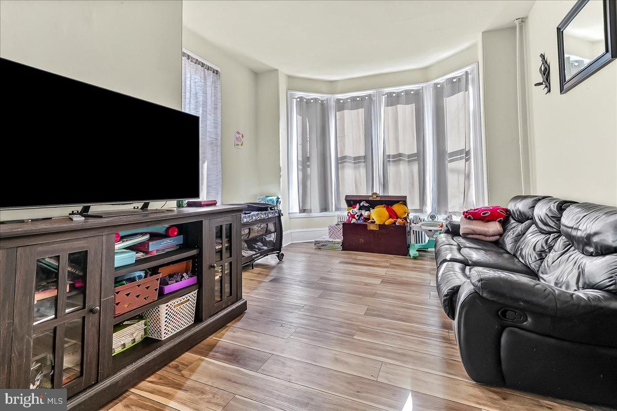 217 West Main Street Elkton, MD 21921 - Photo 5 of 37 a living room with furniture and a flat screen tv